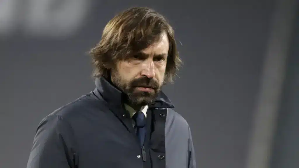 Antonio Conte gesturing emphatically during a football match while wearing a navy blue suit