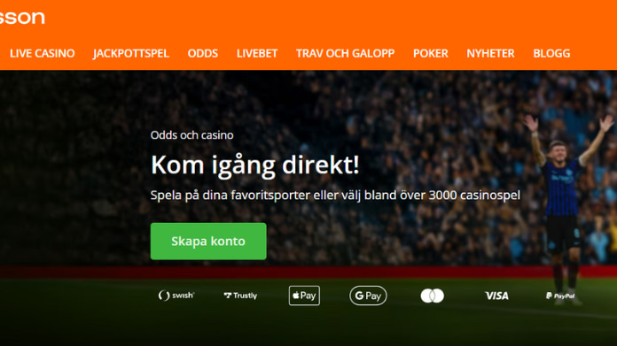 betsson-rapporterar-rekord-q3 Betssons webbplats med erbjudande om sportbetting och casino, publik på fotbollsarena i bakgrunden.