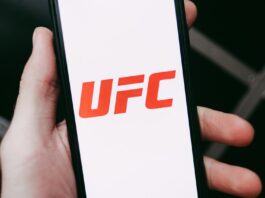 UFC Partners With Polymarket to Bring Real-Time Prediction Markets Into Fight Broadcasts The UFC logo displayed on a phone screen
