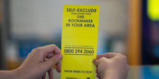 Person holding self-exclusion leaflet