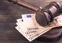 A gavel on a stack of money