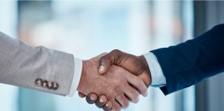 Thank you, welcome and business people in office with handshake for recruitment, deal and hiring negotiation. Job interview, meeting and men shaking hands for b2b agreement, congratulations or offer.