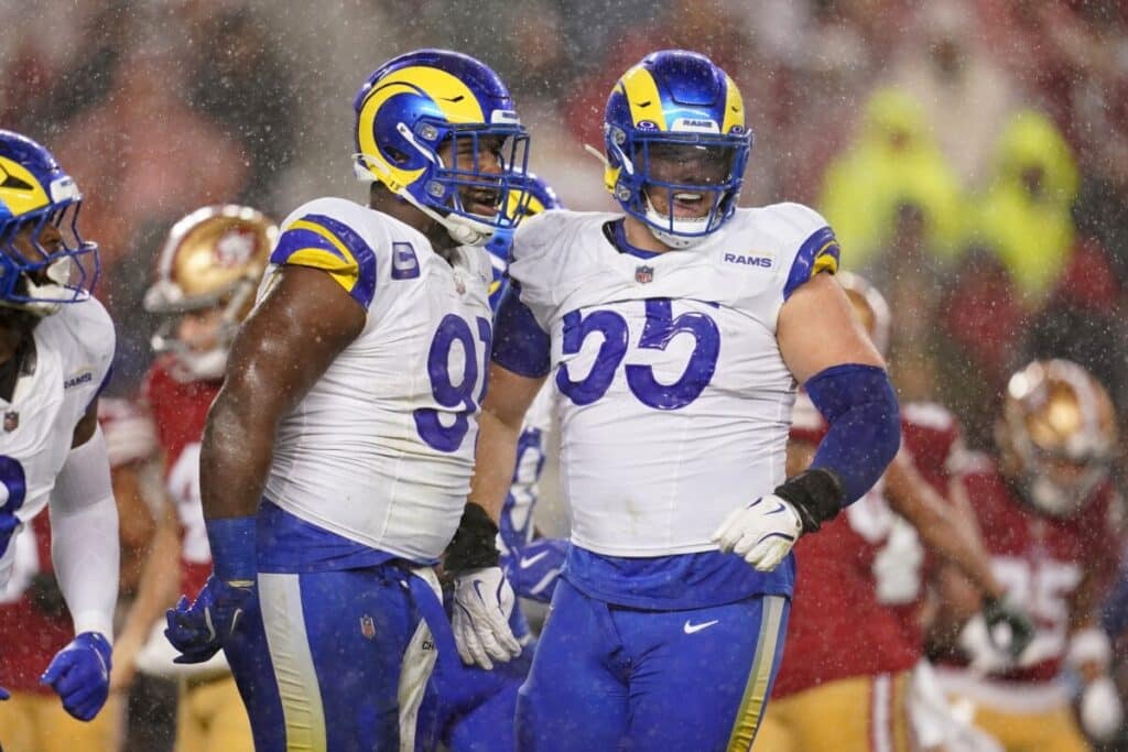 LA's Kobie Turner (91) is congratulated by defensive tackle Braden Fiske (55).