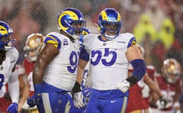 LA's Kobie Turner (91) is congratulated by defensive tackle Braden Fiske (55).