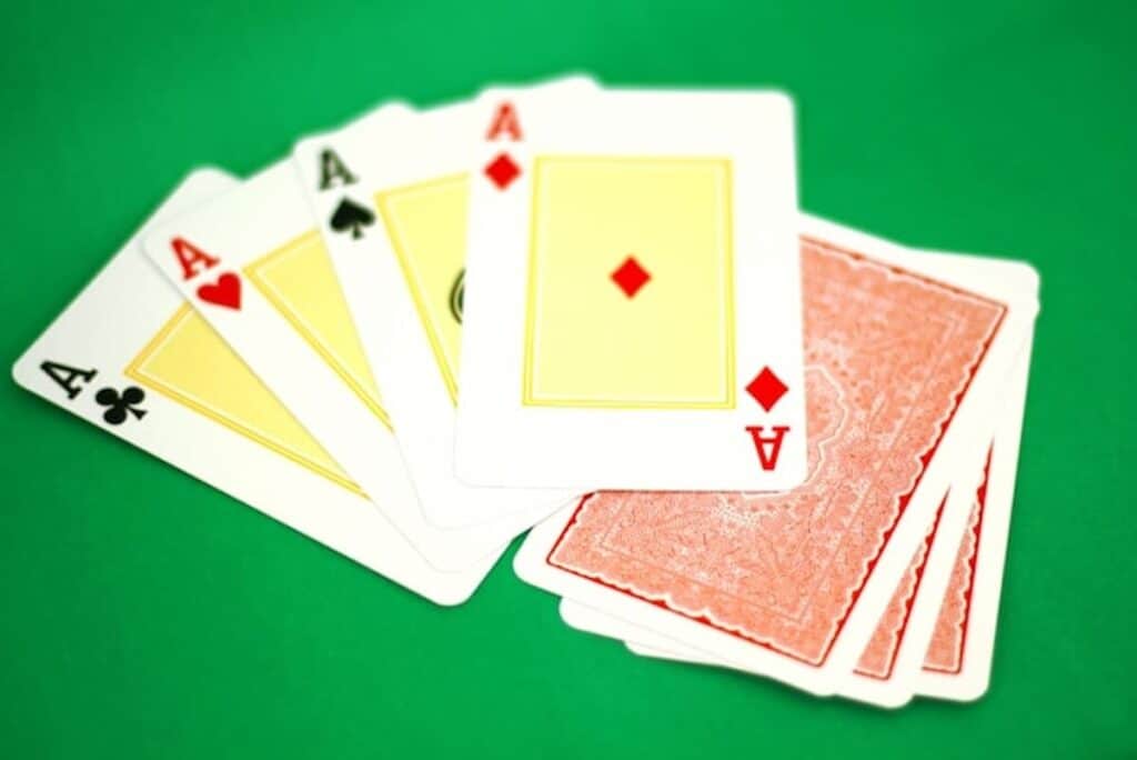 A spread of Ace cards on a table