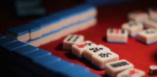 Chinese Communist Party Cadres Charged With Gambling Offenses a set of mahjong tiles on a game board