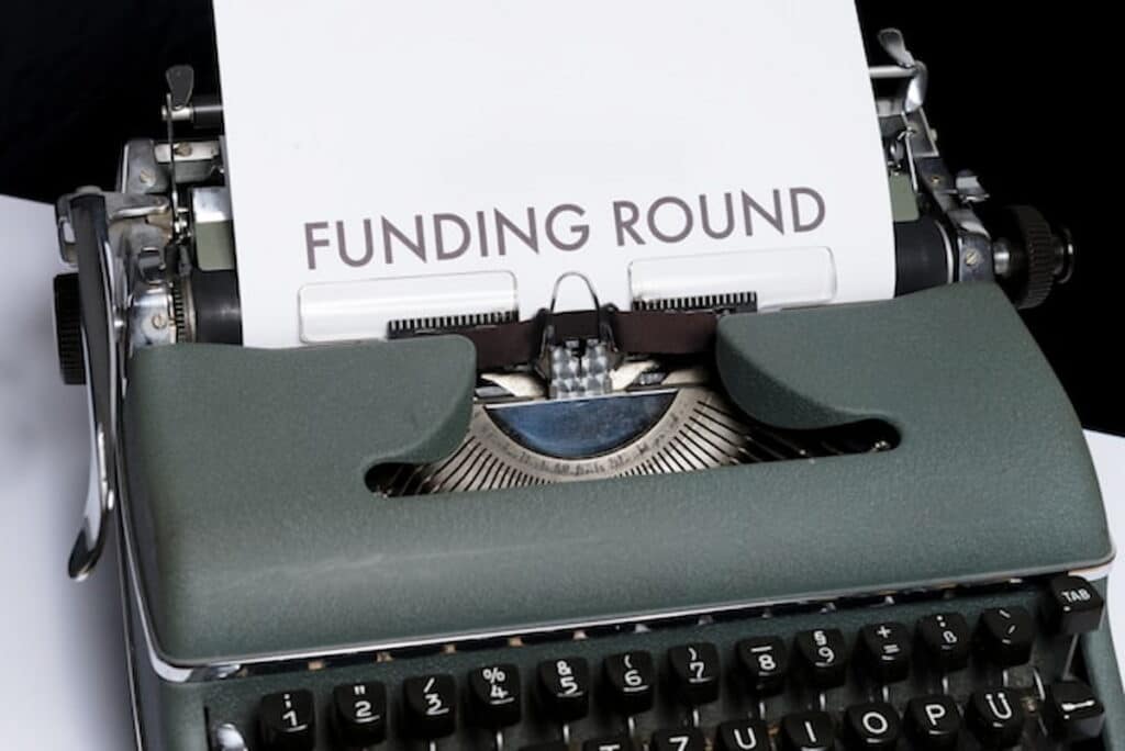 Typewriter with a Funding Round Paper