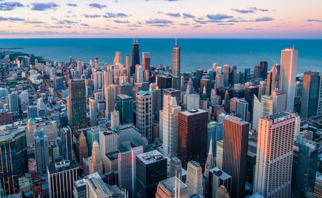 Aerial view of downtown Chicago with Lake Michigan in the background.