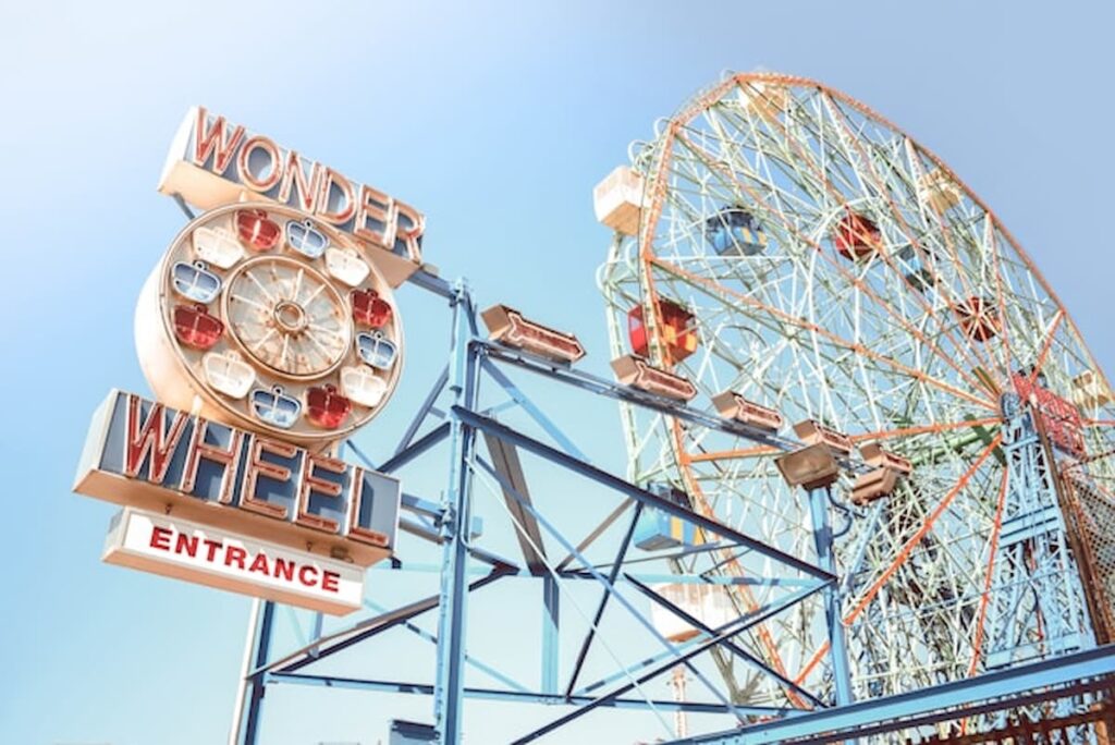 Iconic Wonder Wheel entrance and Ferris wheel at Coney Island on a clear day