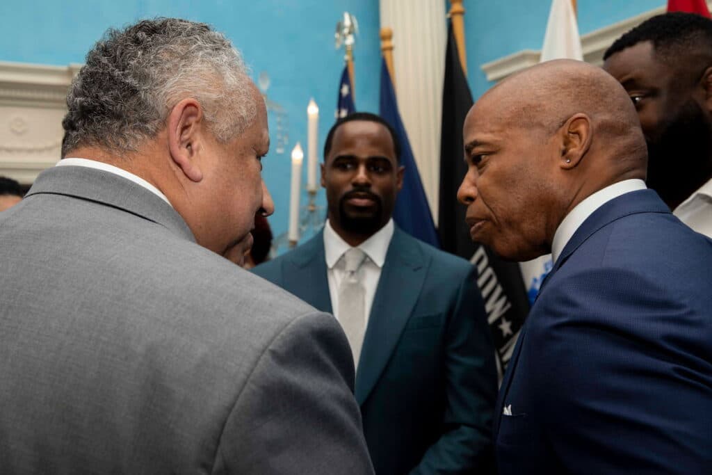 Mayor Eric Adams speaks with Secretary of the Navy Carlos Del Toro at the USS Hamilton announcement.