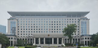 Chinese Communist Party Cadres, Other Top Officials Sanctioned for Gambling China government building