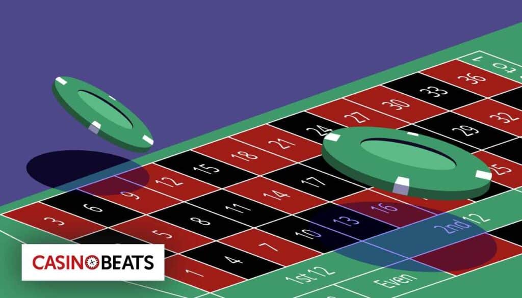 Two green casino chips hover over a roulette table, showcasing red and black numbered squares