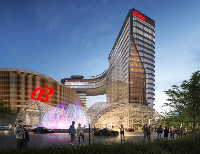 Rendering of Bally’s proposed Bronx casino resort exterior with glass tower and illuminated entrance canopy.