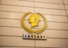 Caesars Q4 Earnings: Digital Sector Thrives, but Company Suffers Large Losses Golden Caesars logo on a wall inside a casino