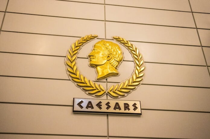 Golden Caesars logo on a wall inside a casino