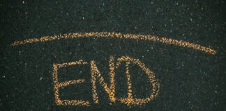 PrizePicks Ends ‘Pick ’Em’ Against the House as DFS Faces Legal Pressure The word “END” written in yellow chalk on asphalt