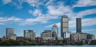 Boston skyline with Prudential Tower, symbolizing regulatory oversight in DraftKings’ $450K fine case.