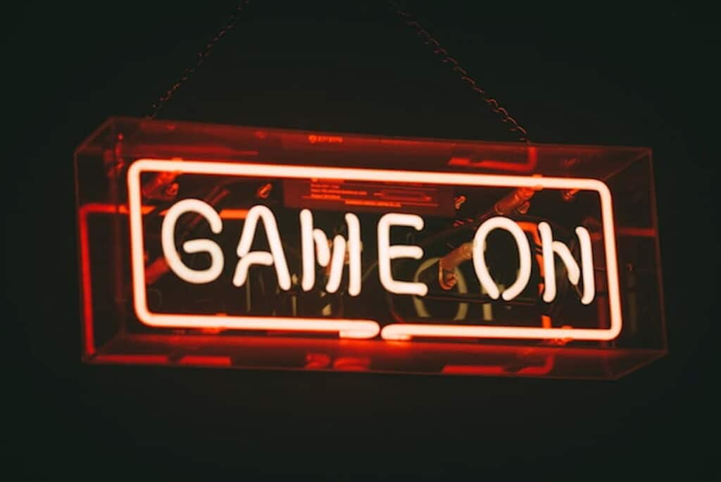 Neon sign displaying "Game On" in red against a dark background