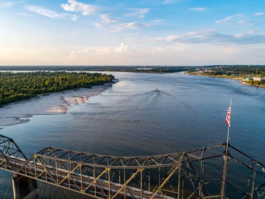 Aerial view of the Mississippi River with a bridge in the foreground.