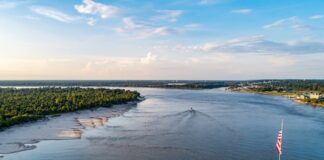 Aerial view of the Mississippi River with a bridge in the foreground.