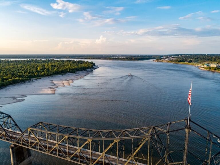 Aerial view of the Mississippi River with a bridge in the foreground.