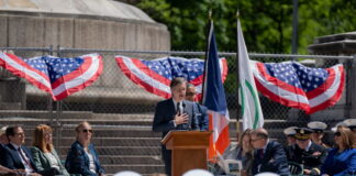New York state Senator speaking at Memorial Day ceremony