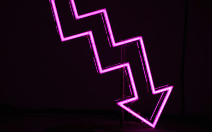 Downward pink neon arrow.