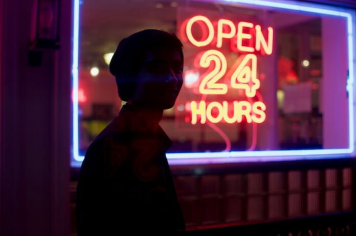 Pennsylvania Senator Flags Dangers of 24/7 Skill Game Parlors Amid Ongoing Legal, Legislative Battles Neon sign reading “Open 24 Hours” outside a storefront at night.