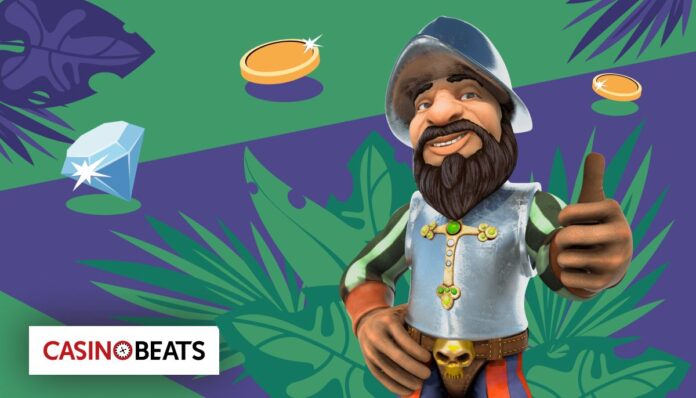 Cartoon explorer Gonzo giving a thumbs up with gold coins and a diamond in the background from the famous Gonzo’s Quest slot game