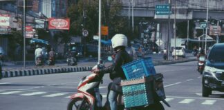 Gambling Debts Drove Indonesian Man to Kill Delivery Driver, Say Police Delivery driver on a motorized scooter