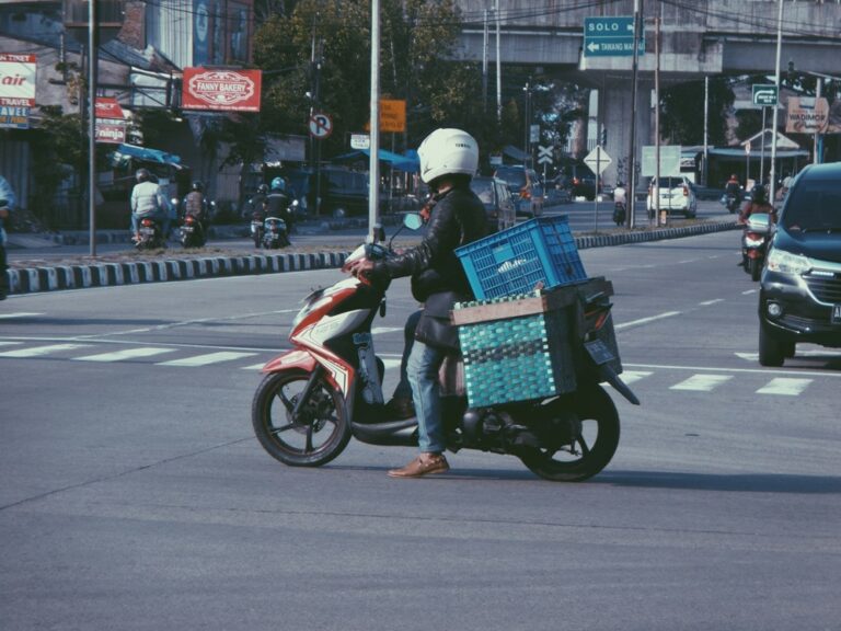 Delivery driver on a motorized scooter