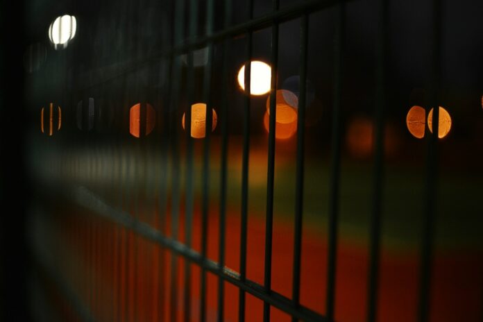 9 Ex-Gov’t Employees Jailed in Latest Indonesia Online Casino Protection Racket Case Judgment A dark photo of bars