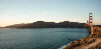 FanDuel DFS Class Action Lawsuit in California Dropped — For Now View of the Golden Gate Bridge and California coastline at sunset.