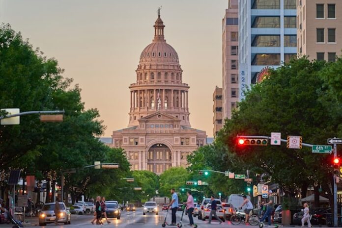 cityscape-capitol-building.jpg Busy downtown street with a historic dome building in the background