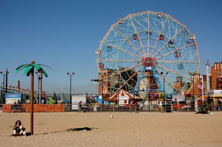 Coney Island’s Wonder Wheel on a sunny day with the beach in the foreground