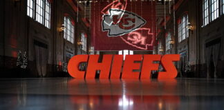 Nine Sportsbooks Apply for Missouri Sports Betting Licenses Large CHIEFS sign displayed inside a historic hall with Kansas City Chiefs logo in the background