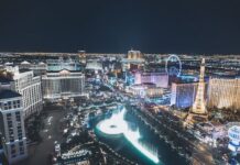 Aerial view of the Las Vegas Strip at night with illuminated casinos and hotels