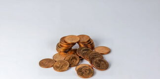 Stack of coins on a white background.