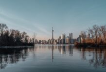 AGCO Seizes Over 50 Illegal Skill Game Machines Across Ontario Toronto skyline with CN Tower viewed across the water at sunset.