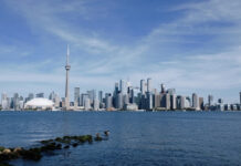Toronto skyline with CN Tower and Rogers Centre viewed from across Lake Ontario
