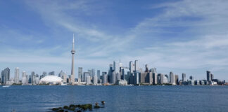 Toronto skyline with CN Tower and Rogers Centre viewed from across Lake Ontario