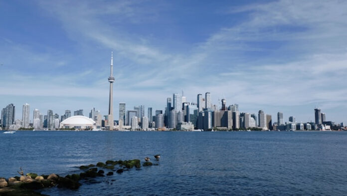 Toronto skyline with CN Tower and Rogers Centre viewed from across Lake Ontario