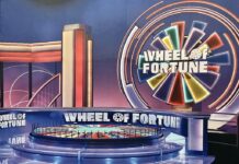 Wheel of Fortune game show set with colorful wheel and stage design
