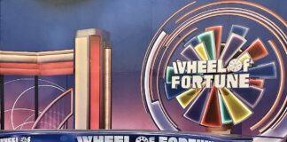 Wheel of Fortune game show set with colorful wheel and stage design