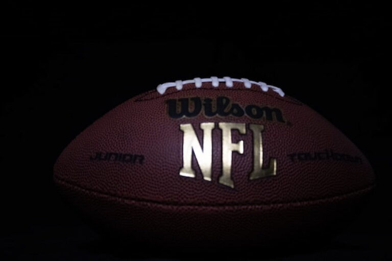 Close-up of a Wilson NFL football on a dark background