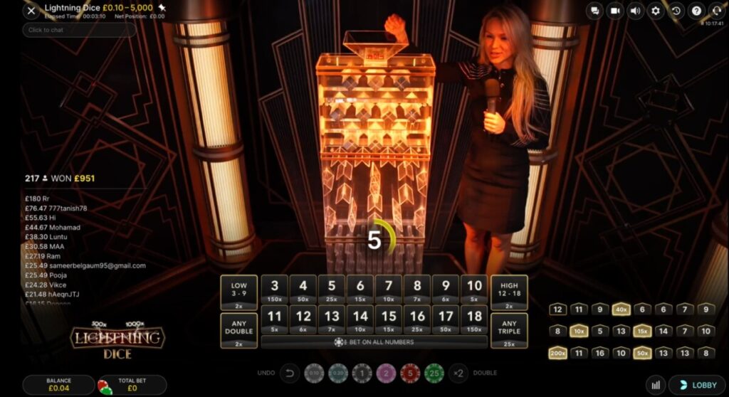 Dealer hosting a live round of Lightning Dice as three dice drop through the illuminated tower