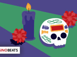 Illustration of a colorful sugar skull with vibrant patterns, beside a lit purple candle and red marigolds