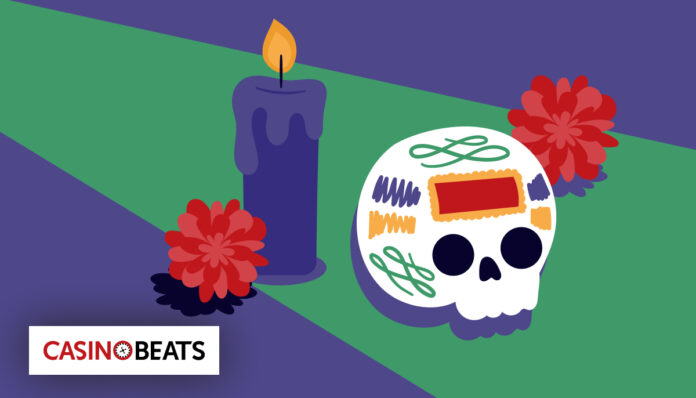 Illustration of a colorful sugar skull with vibrant patterns, beside a lit purple candle and red marigolds