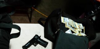 Ex-Armored Truck Driver Accused of Stealing $113K Bound for Las Vegas Casinos Handgun and duffel bag filled with stacks of cash on a table