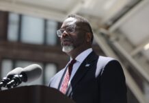 Chicago Mayor Brandon Johnson speaking at a Memorial Day event.